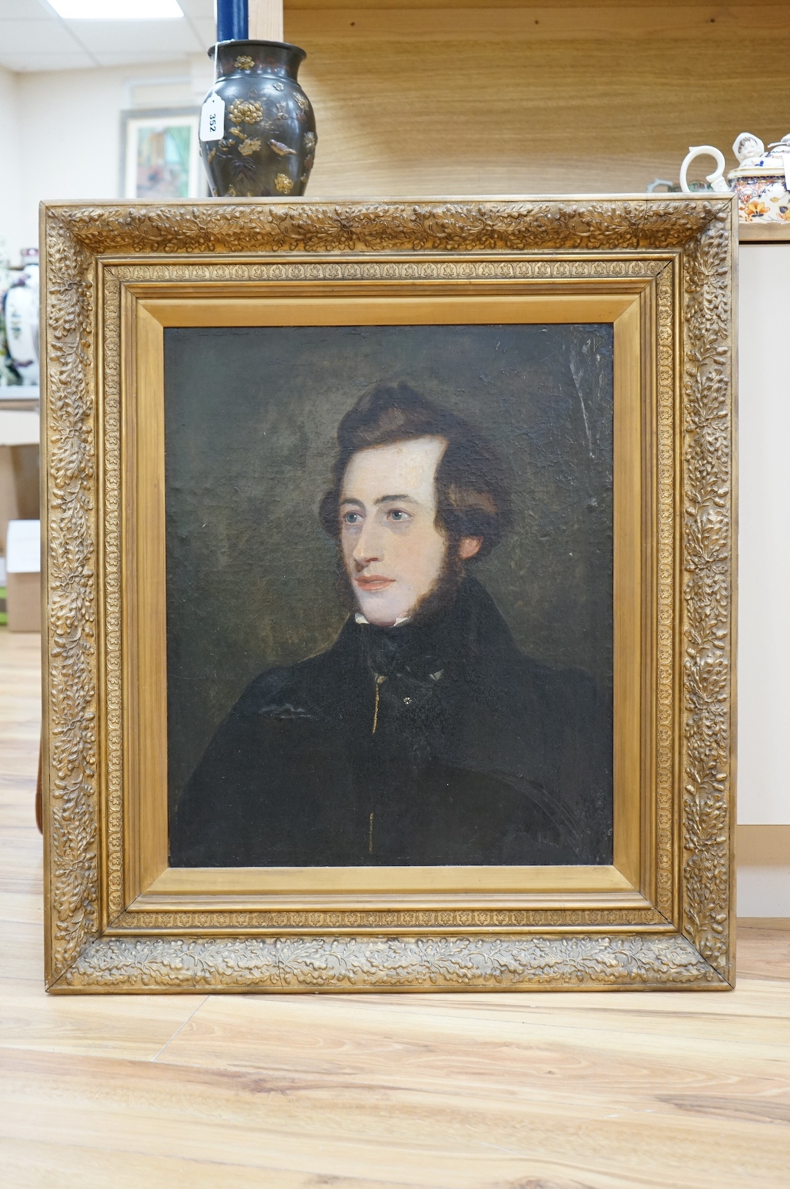 Early to mid 19th century oil on board, Head and shoulders portrait of a gentleman, unsigned, 59 x 49cm, ornate gilt frame. Condition - fair